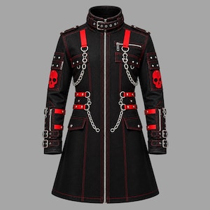 May include: A black long-sleeve jacket featuring red contrast stitching, red skull patches on the sleeves, silver-tone metal chains, multiple buckled straps, and a front zipper closure. The high collar includes a buckle strap and silver eyelets.