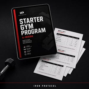 May include: A digital tablet displaying the Iron Protocol Starter Gym Program 4-week plan with a black background, red accents, and white text. Beside it are printed workout sheets detailing exercises, sets, reps, and rest times for three days.