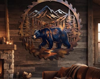 May include: A circular metal wall art piece shaped like a saw blade, featuring a cutout design of a walking bear in the foreground, a dense forest of pine trees in the midground, and snow-capped mountain peaks in the background with a bronze finish.