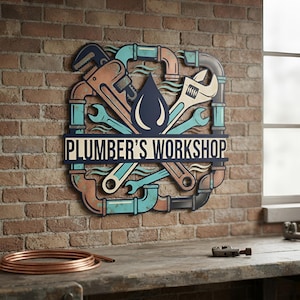 May include: A decorative wall sign featuring a stylized illustration of plumbing tools, including a pipe wrench and adjustable wrench, arranged around a central water drop icon. The text PLUMBER'S WORKSHOP is printed in bold letters across the center.