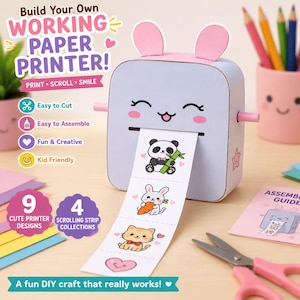 May include: A DIY paper printer craft kit featuring a light blue, box-shaped printer with pink ears and a smiling face. A paper strip with illustrations of a panda, rabbit, cat, and heart extends from the slot. Includes text: Build Your Own WORKING PAPER PRINTER!