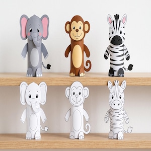 Op de afbeelding: Zes papieren dierenfiguren in twee rijen. De bovenste rij bevat een grijze olifant, een bruine aap en een zwart-witte zebra. De onderste rij toont dezelfde drie dieren als witte papieren omtrekken die ingekleurd kunnen worden.