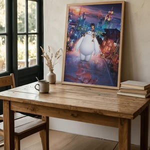 May include: A framed vertical wall art print featuring a colourful animated scene of a large white robot and a young person standing on a city street at sunset, with a bridge and skyscrapers in the background, displayed in a light wood frame.