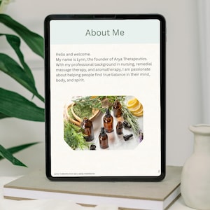 May include: A digital tablet displaying an About Me page for Arya Therapeutics. The text introduces Lynn, a nurse and therapist. Below the text is a photograph of amber glass essential oil bottles, green herbs, and lemon slices on a white surface.