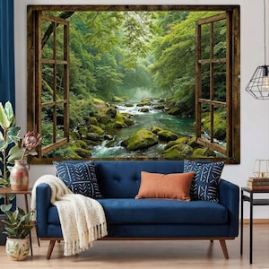 May include: A rectangular wall art print featuring an open wooden window frame looking out onto a lush green forest with a flowing river and moss-covered rocks. The scene depicts a vibrant natural landscape with dense trees and rushing water.