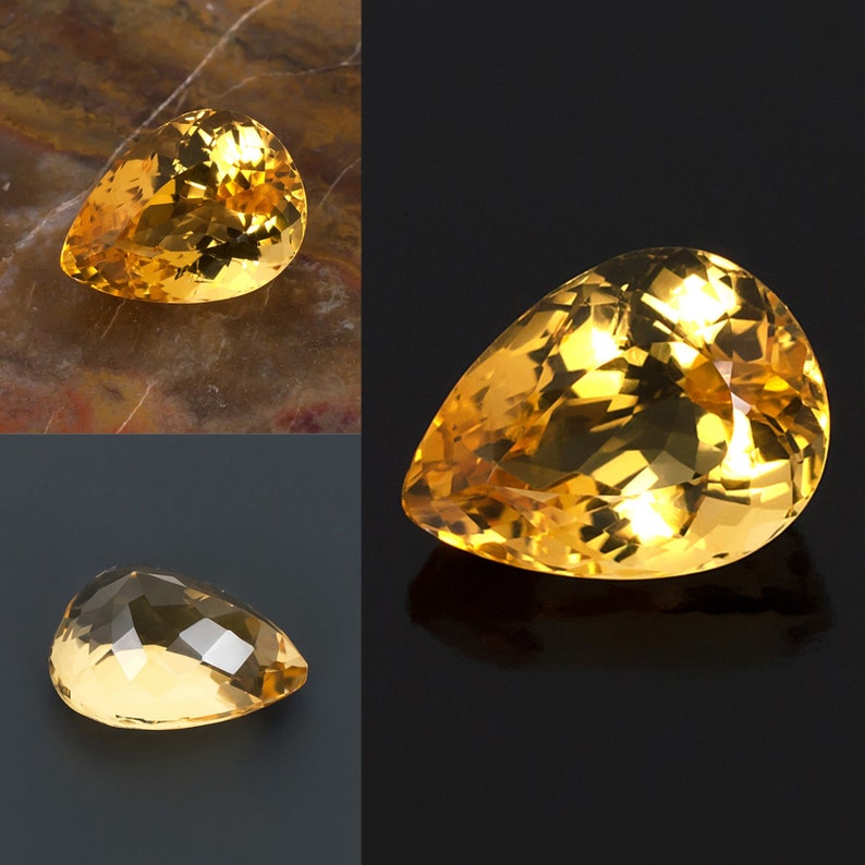 May include: Three pear-shaped gemstones with a golden yellow color. The gemstones are faceted and have a high shine.