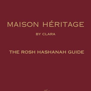May include: A deep burgundy rectangular guide cover featuring the gold text MAISON HÉRITAGE BY CLARA and THE ROSH HASHANAH GUIDE. At the bottom, a thin gold line drawing depicts a single pomegranate fruit hanging from a leafy branch.