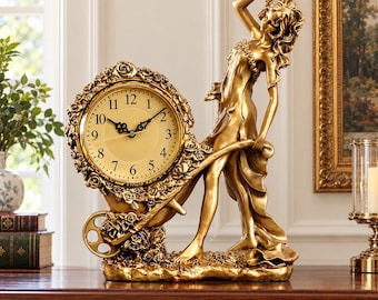 May include: A gold-toned table clock featuring a standing figure pushing a wheelbarrow adorned with sculpted roses. The clock face is round with black numerals and hands, set within a decorative frame of roses. The entire piece is finished in a metallic gold color.