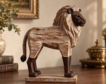 May include: A standing lion figurine featuring a dark brown face and lower legs, contrasted with a light brown, textured body and mane. The sculpture is mounted on a rectangular base, showcasing a carved wood-like finish throughout the piece.