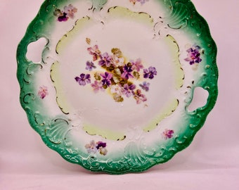 Plato para tarta de porcelana antigua de Prusia RS, con motivos florales verdes, circa 1920
