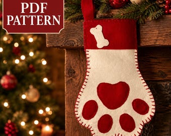 Puede incluir: Un calcetín navideño de fieltro con forma de huella, con un puño rojo y una aplicación de hueso blanco. El cuerpo principal es blanco con una almohadilla central roja en forma de corazón y cuatro almohadillas redondas rojas, unidas por costuras.