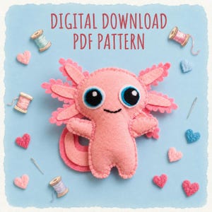 May include: A pink felt axolotl plush toy with large blue and black eyes and a stitched smile, surrounded by small felt hearts, sewing needles, and spools of thread on a light blue background with the text DIGITAL DOWNLOAD PDF PATTERN.