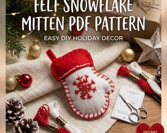 Puede incluir: Una manopla de fieltro blanco con costuras rojas y un diseño de copo de nieve bordado en rojo. La manopla se acompaña de hilo de bordar rojo y blanco, tijeras plateadas pequeñas y una tarjeta de instrucciones con el texto Felt Snowflake Mitten PDF Pattern.
