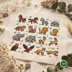 May include: A square piece of cream-colored fabric featuring a cross-stitch pattern of various wild animals including horses, zebras, tigers, lions, elephants, antelopes, eagles, and cheetahs, interspersed with small clouds, suns, and paw prints.