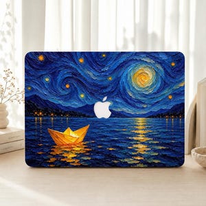 May include: A laptop skin featuring a textured oil painting style print of a yellow paper boat floating on dark blue water under a swirling night sky with a bright yellow moon and stars, centered with a white Apple logo cutout.