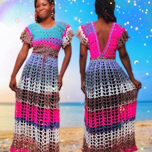 May include: A long, multi-colored crochet dress with a deep V-back. The dress is made with a variety of colors, including pink, blue, brown, and white. The dress has a fitted bodice and a flowing skirt.