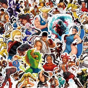 May include: A collection of die-cut vinyl stickers featuring various Street Fighter characters in dynamic action poses, including Ryu, Chun-Li, Guile, and Blanka, rendered in a vibrant, detailed anime art style with bold outlines and colours.