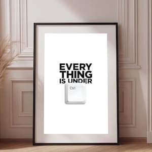 May include: A framed wall art print featuring a white background with the black text "EVERY THING IS UNDER" positioned above a single white computer keyboard key labeled "Ctrl" in the center of the composition.