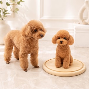 May include: A light brown curly-haired poodle stands next to a smaller, realistic needle-felted poodle figurine that is sitting on a round, light-coloured wooden base. Both figures feature dark eyes, black noses, and dense, textured fur.