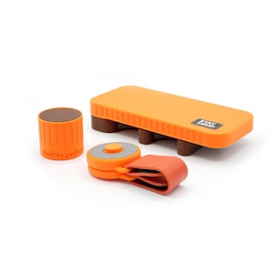 May include: A set of orange and brown sharpening tools including a rectangular block with the text STAY SHARP, a cylindrical tool with the text Built to perform, and a circular device with an orange strap and a grey center button.