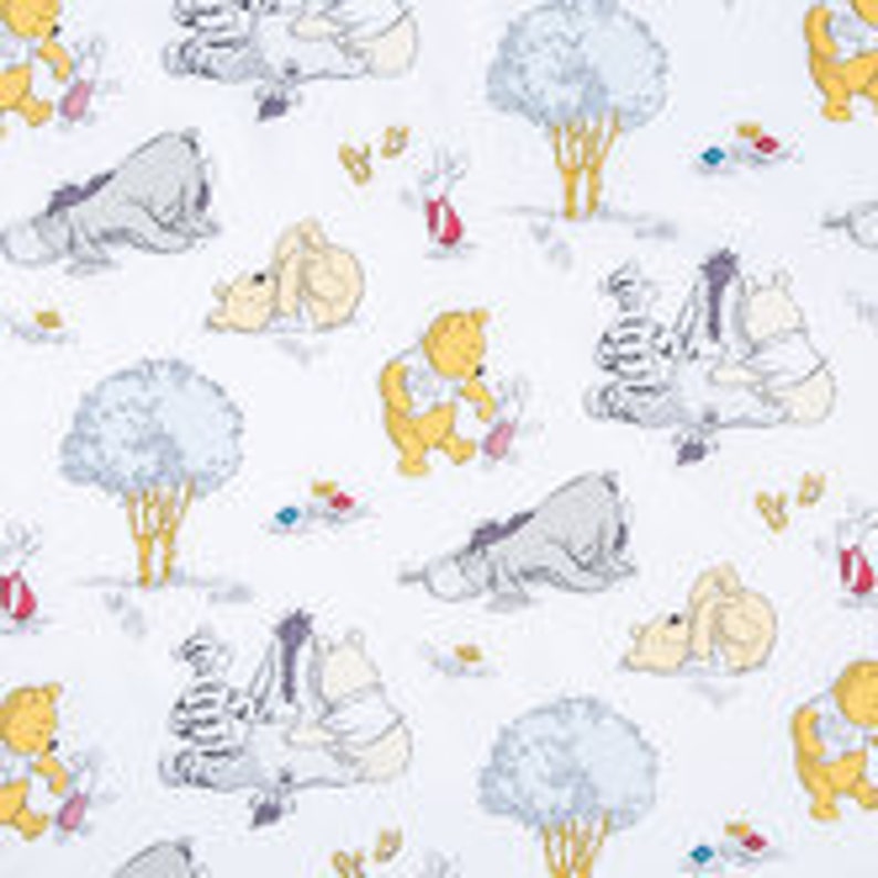 May include: A white fabric featuring a repeating pattern of Winnie the Pooh and his friends, including Piglet, Tigger, and Eeyore. The characters are depicted in a cartoon style and are surrounded by trees, flowers, and other woodland elements.