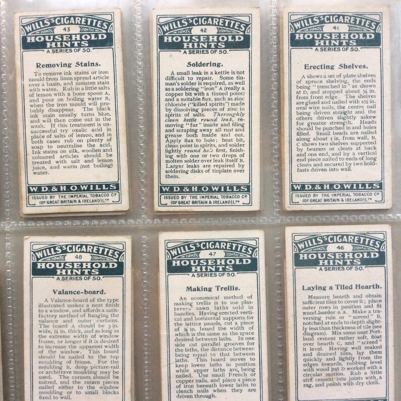 May include: A set of vintage Wills's Cigarettes "Household Hints" cards, offering practical advice on household tasks such as removing stains, soldering, and building a valance-board. Each card has text and a decorative border.