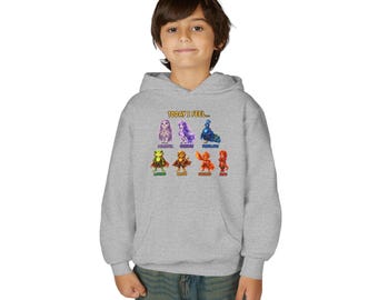 Puede incluir: Una sudadera con capucha gris jaspeado que presenta un estampado gráfico con el texto "TODAY I FEEL..." sobre siete personajes ilustrados coloridos, cada uno etiquetado con una emoción como "PEACEFUL," "GORGEOUS," "FABULOUS," "LOVED," "BRAVE," "EXCITED," y "SHY."