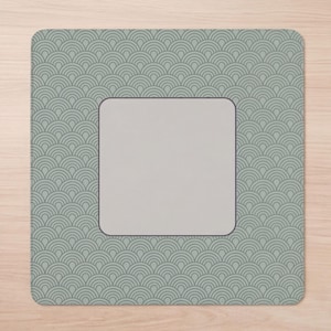 May include: A square mouse pad featuring a repeating sage green and dark gray fan-shaped scale pattern. The center of the mouse pad contains a solid, light gray square with rounded corners, framed by a thin dark gray border.
