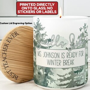 May include: A white candle with a forest design and the text "Smells Like Ms. Johnson is Ready for Winter Break." The candle has a wooden lid engraved with "Best Teacher Ever."