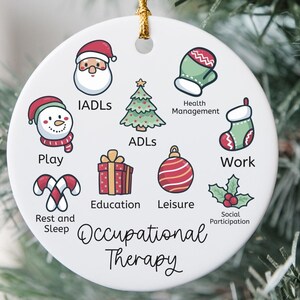 May include: A white ceramic Christmas ornament with a gold string for hanging. The ornament features colorful illustrations and the words "Occupational Therapy." The illustrations include a snowman, Santa, a Christmas tree, and other festive icons.