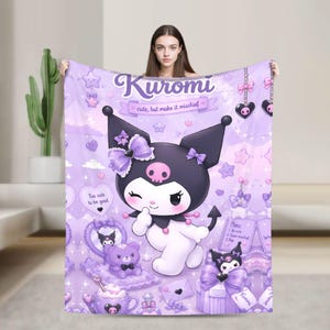 May include: A light purple fleece blanket featuring the character Kuromi with the text Kuromi and cute, but make it mischief. The design includes stars, hearts, a purple teddy bear, a teacup, and gift boxes in a repeating pastel aesthetic.