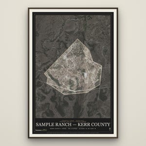 May include: A framed aerial map print of Sample Ranch in Kerr County, Texas. The map features a dark, high-contrast satellite view of the terrain with a highlighted white boundary outline. Text at the bottom reads Sample Ranch - Kerr County.