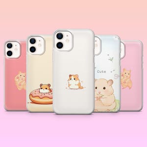 May include: Five clear smartphone cases featuring various illustrations of small hamsters. The designs include a hamster with a pink donut, a standing hamster, and a larger hamster graphic with the word Cute printed in a simple black font.