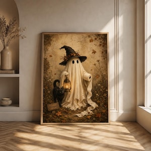 May include: A framed wall art print depicting a ghost wearing a witch hat, holding a lit lantern and a roll of toilet paper. A black cat stands nearby next to a small sign that reads Occupied. The scene is set in a forest with autumn leaves.