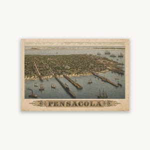 May include: A vintage-style bird's-eye view print of Pensacola, Florida, featuring a detailed cityscape with numerous sailing ships and steamships docked at long piers extending into the water. The text PENSACOLA is centred below.