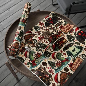May include: Wrapping paper featuring a repeating pattern of Christmas cryptids including Mothman, Bigfoot, and the Loch Ness Monster wearing Santa hats. The cream-colored paper displays festive icons like candy canes, pine trees, and UFOs with the text Christmas Cryptids.