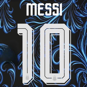 May include: A black sports jersey featuring the name MESSI and the number 10 in large white block lettering. The background displays a repeating blue and black floral pattern. The number 10 includes a small emblem at the base of each digit.