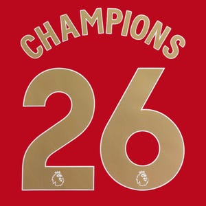 May include: A red fabric surface featuring the word CHAMPIONS printed in a gold sans-serif font in an arc above the large gold number 26. Each digit of the number 26 contains a small gold lion head icon with a crown at the base of the numeral.