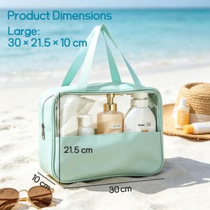 Puede incluir: Un neceser rectangular de color verde menta con un panel frontal transparente, dos asas superiores y cierre de cremallera. La bolsa mide 30 x 21,5 x 10 cm y contiene varios frascos blancos y beige. El texto dice: Product Dimensions Large: 30 x 21.5 x 10 cm.