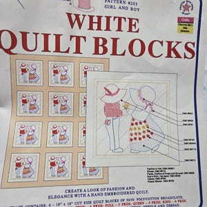 May include: A Jack Dempsey Needle Art quilt block pattern package, item 732, pattern 203, titled White Quilt Blocks. The packaging features a grid of embroidered girl and boy designs, colour-coded DMC thread charts, and fabric details.