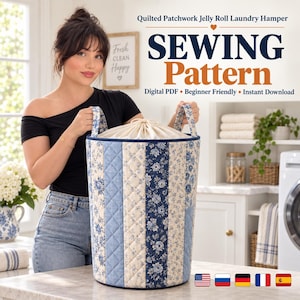 May include: A cylindrical laundry hamper featuring a quilted patchwork design with alternating vertical stripes of blue and cream floral fabric. The hamper includes two fabric handles and a cream-colored drawstring closure at the top opening.