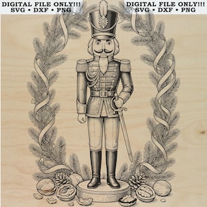 May include: A black and white digital illustration of a nutcracker soldier standing on a circular base, framed by a wreath of pine branches and ribbons. The text DIGITAL FILE ONLY!!! SVG • DXF • PNG is printed at the top of the image.