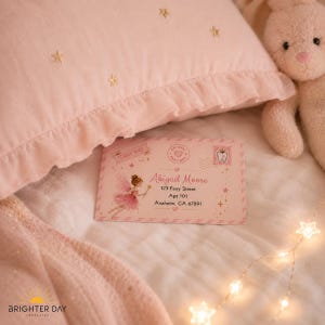 May include: A rectangular envelope with a pink background featuring a fairy illustration, the text Fairy Mail, and the address for Abigail Moore, 123 Fairy Street, Apt 101, Anaheim, CA 67891. The envelope includes a stamp with a tooth icon.