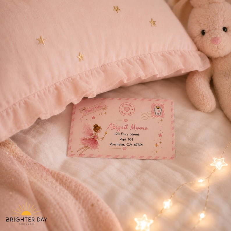 May include: A rectangular envelope with a pink background featuring a fairy illustration, the text Fairy Mail, and the address for Abigail Moore, 123 Fairy Street, Apt 101, Anaheim, CA 67891. The envelope includes a stamp with a tooth icon.
