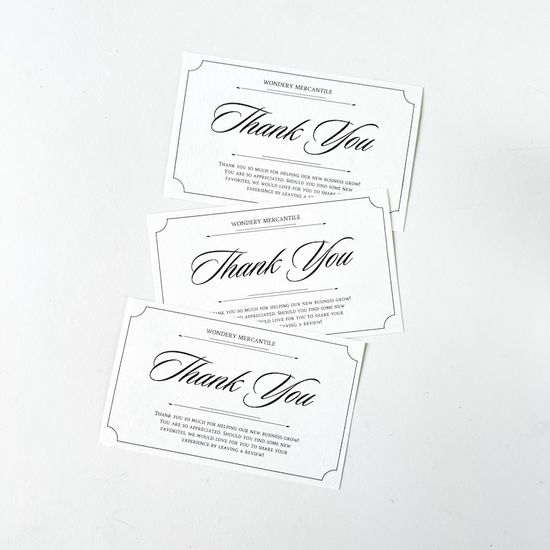 May include: Three white thank you cards with black text and borders. The text on the cards reads "Wondery Mercantile" and "Thank You". The text below the thank you message reads "Thank you so much for helping our new business grow! You are so appreciated. Should you find some new favorites, we would love for you to share your experience by leaving a review!"