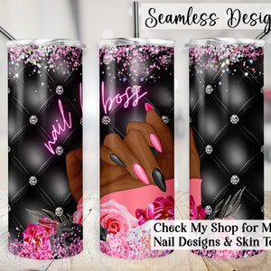 May include: A black and pink tumbler with a design of a hand with pink and black nails. The tumbler has a black background with a diamond pattern and the words "nail boss" in pink neon lettering.