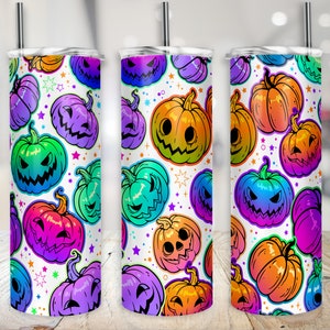 May include: Three stainless steel tumblers with a white background and a pattern of colorful jack-o'-lantern faces. The jack-o'-lanterns are in various shades of orange, green, purple, and blue.