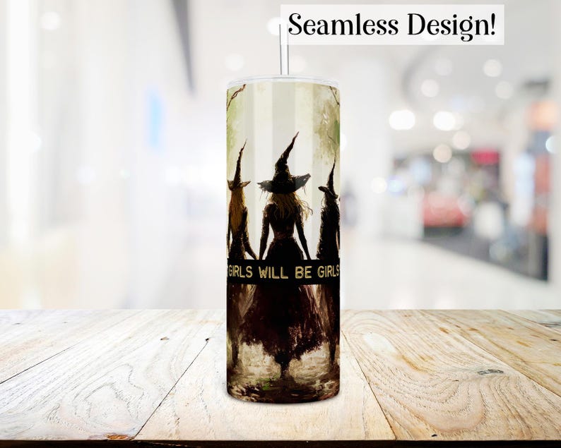 May include: A white tumbler with a design of three witches in black silhouettes walking together. The witches are wearing pointed hats and long robes. The text "Girls Will Be Girls" is printed on the tumbler.