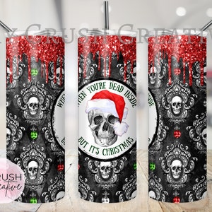 May include: A black and white tumbler with a skull wearing a Santa hat and the text "When you're dead inside but it's Christmas". The tumbler has a red glitter design with drips.