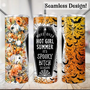 May include: Three Halloween-themed tumblers with stainless steel straws. One features pumpkins and flowers, another has a coffin design with text, and the third displays bats and spiderwebs. The text reads "Move Over Hot Girl Summer It's Spooky Bitch Season".